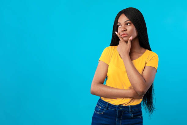 istock African American Lady Thinking Standing Near Blank Space, Blue Background 1331291996