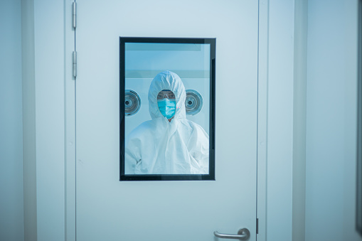Female doctor in a protective suit portrait