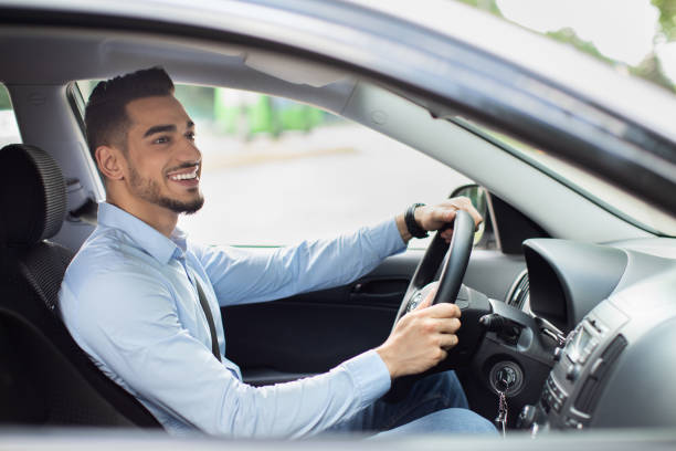 istock Excited arab guy going to office, driving his car 1331294031