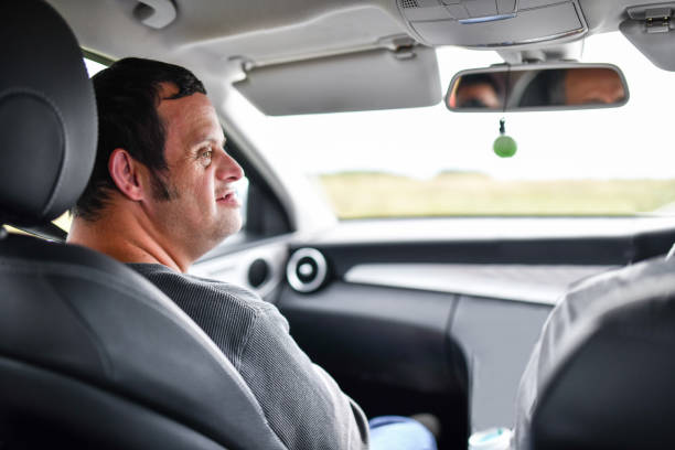 istock Male With Down Syndrome Riding In Car 1331295219