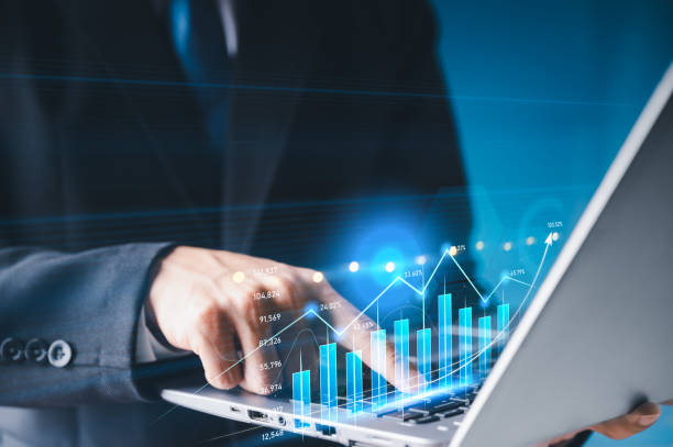 istock Money businessman touch virtual screen screen displaying a crypto currency featuring stock tickers or graphs. Stock trading platform concept. professional financial. Stock market data candlesticks. 1331297578