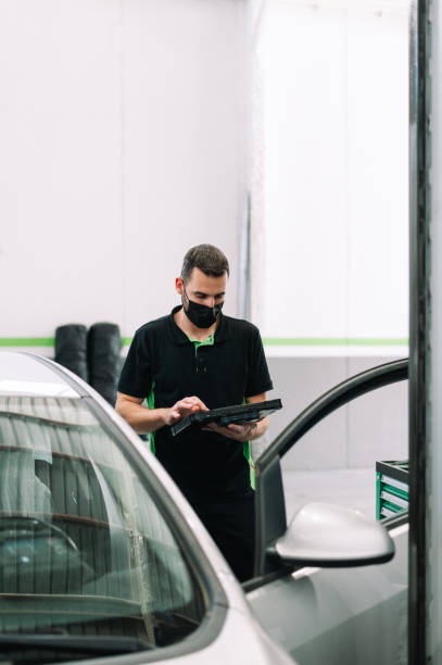 istock Mechanic wearing surgical mask using Diagnostic machine tools for car stock photo 1331297615
