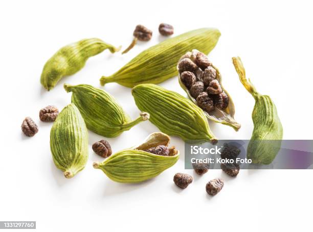 Cardamom Pods And Seeds Isolated On White Background Stock Photo - Download Image Now