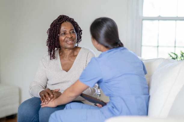 istock Nurse offering emotional support during home visit 1331298186