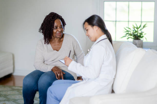 istock Doctor conducts home visit 1331298197