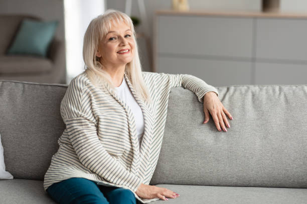 istock Mature woman having rest at home, posing looking at camera 1331299693
