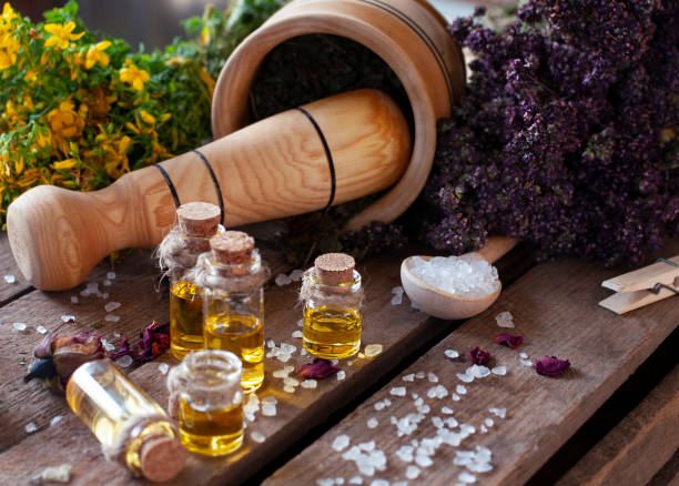 istock Essential oil bottles with dry ingredients 1331299696