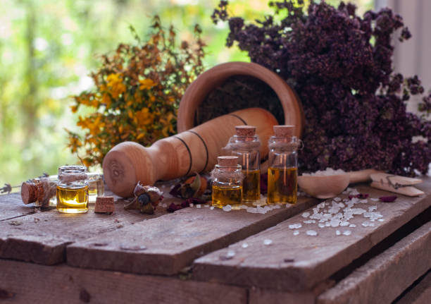 istock Essential oil bottles with dry ingredients 1331299698
