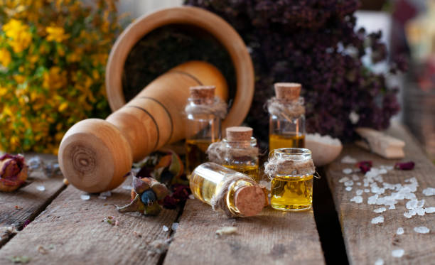 istock Essential oil bottles with dry ingredients 1331299714