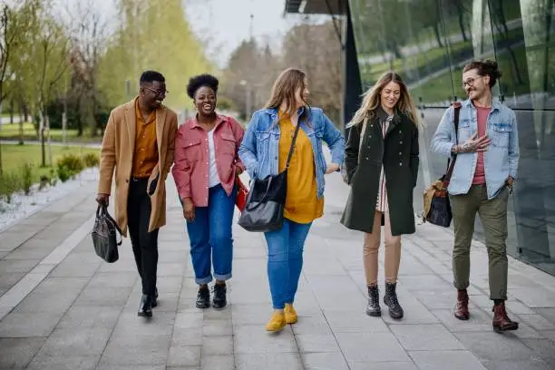 Photo of Group of international students having fun after studying