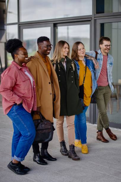 istock Group of multiethnic students walking together outdoors in college campus 1331300261