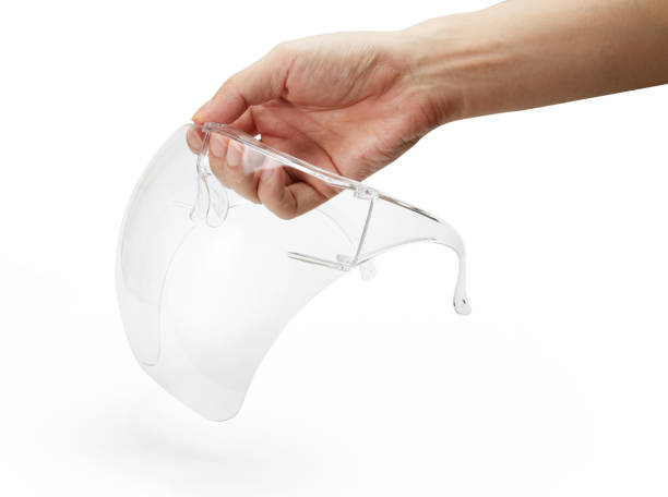 istock Plastic face shield holding by hand isolated on white with clipping path 1331302917