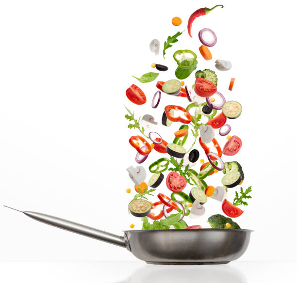 istock Fresh vegetables flying into steel pan, isolated on white background 1331305149