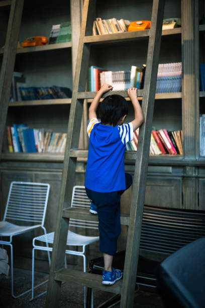 The boy who climbed up the bookcase
