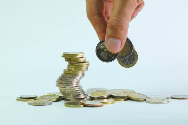 istock Hand holding 2 euros coins 1331307278