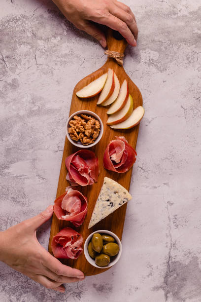 istock Serving board with meat and cheese snacks 1331309378