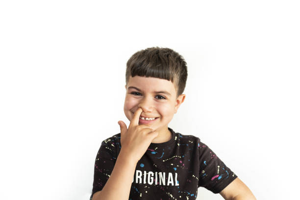 istock caucasian kid making a finger-in-the-nose gesture on white background 1331321298