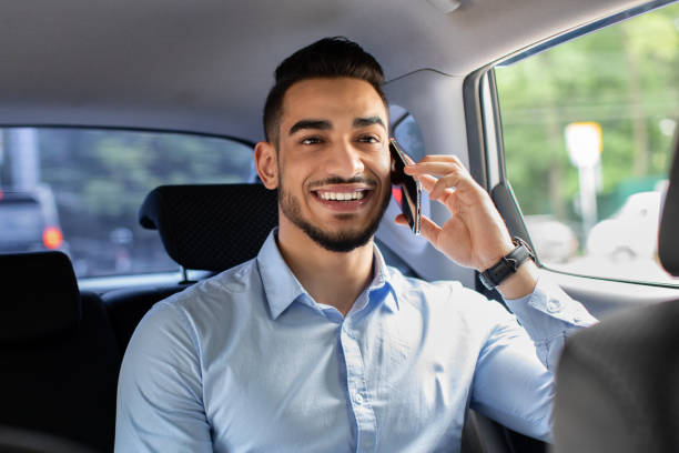 istock Cheerful middle-eastern manager talking to business partner on cellphone 1331321450
