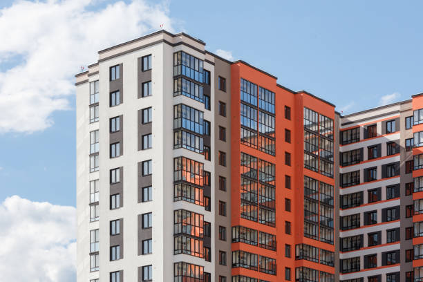 istock new high rise apartament building with multiple balcony and windows on blue sky with white clouds background 1331323985