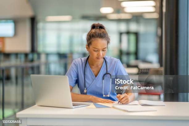 Medical Student Studying Stock Photo - Download Image Now - Nurse, Learning, Computer