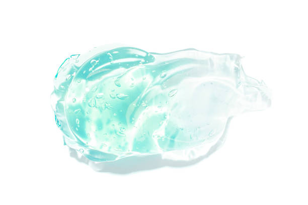 istock Transparent blue moisture face serum smeared on white background isolated. Hydrating hyaluronic acid. Hair gel with bubbles. Cosmetic products for makeup and skin care. Cosmetology. 1331326801