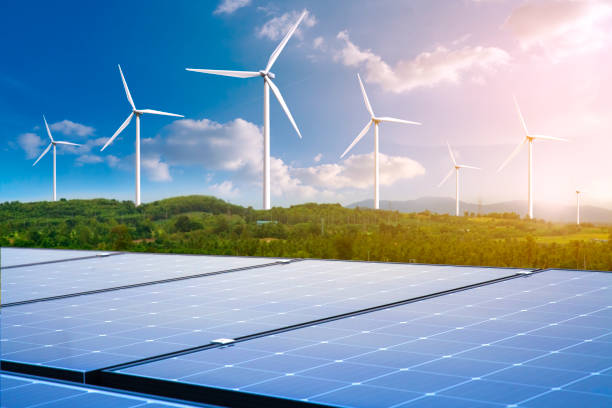 istock solar panels with wind turbines 1331328072