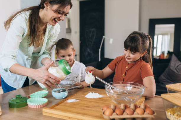 istock mother and kids baking at home 1331328905