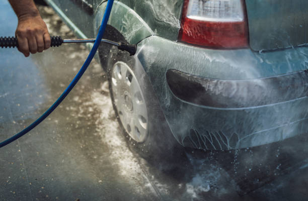 istock Car washing. Cleaning Car Using High Pressure Water. 1331328955
