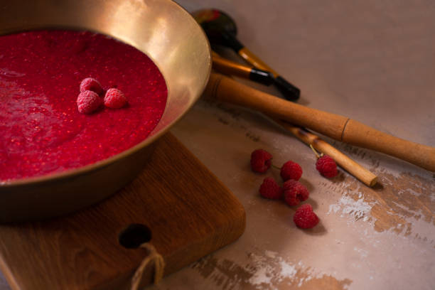 istock Homemade raspberry jam in copper rustic bowl on wooden table 1331331979