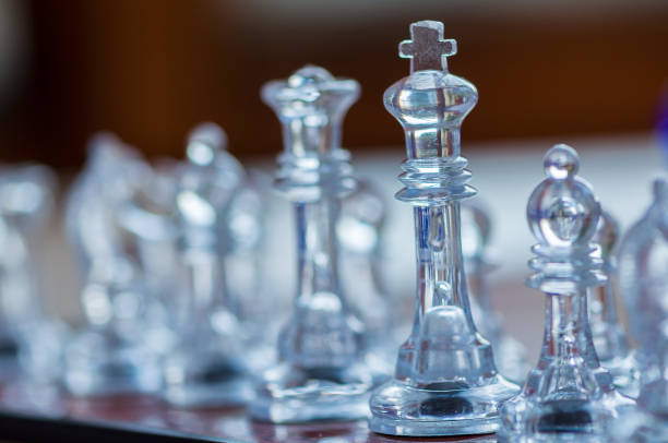 istock Close-up of a transparent king chess piece 1331333803