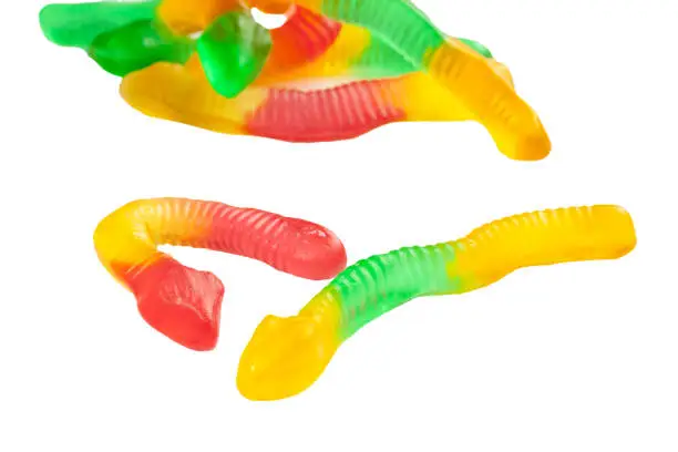 Photo of Colorful gummy worms isolated on white background