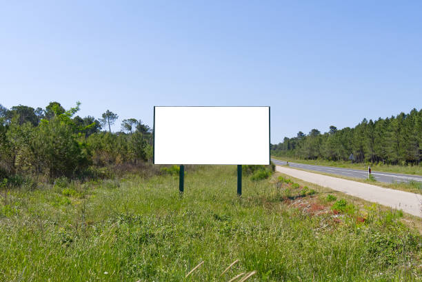 istock outdoor billboard banners in fields on summer day mockup. 1331335080