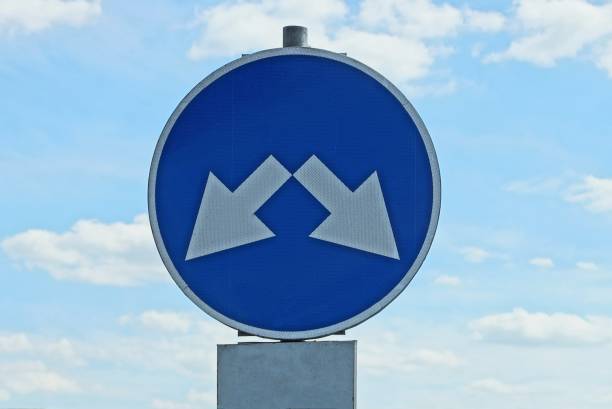 istock round blue road sign with two white arrows 1331335543