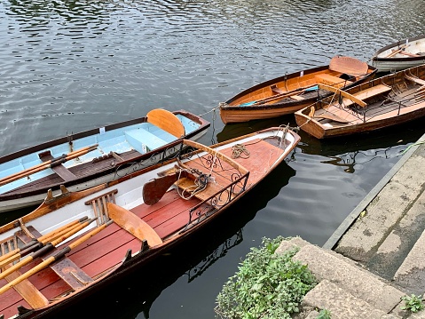 Moored vessel boats at Richmond Bridge Boat Club at the Thames riverside, south west of London