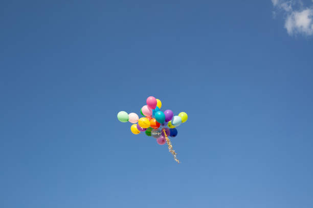 istock A bunch of balloons fly into the sky 1331342436