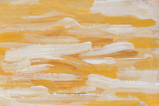 Yellow and white acrylic oil painting abstract background. A fragment of a painting on canvas. Colored beige pastel texture. Modern art, active brush strokes. Summer art background in warm sand shades