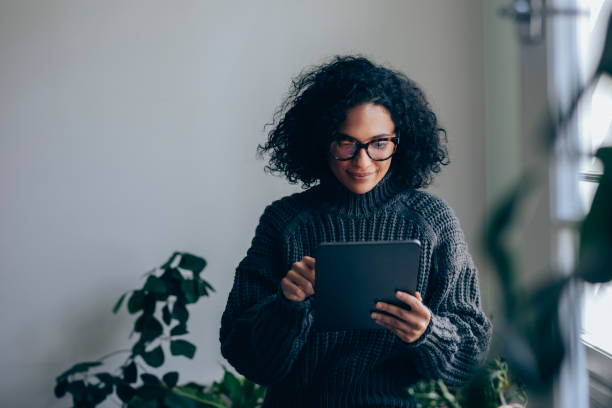 Beautiful Woman Using a Digital Tablet at Home