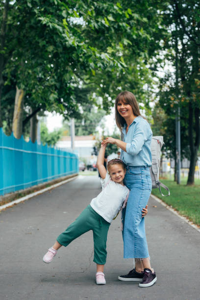 istock Mother Dropping her Daughter off to School 1331345424