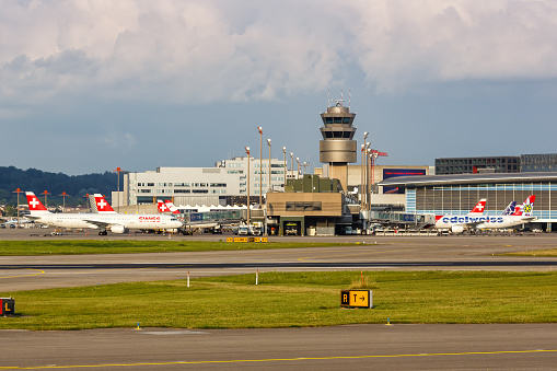 Zurich, Switzerland - July 22, 2020: Airplanes and Terminal at Zurich Airport (ZRH) in Switzerland.