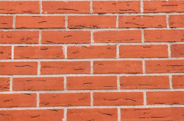 istock brick wall red grunge background with gray lines joints 1331349982