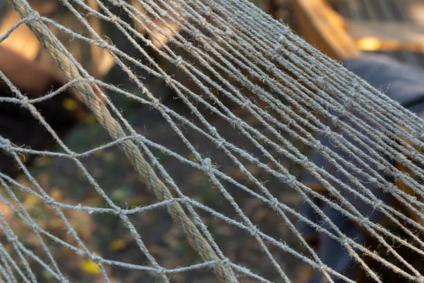 istock fishing net close-up with large holes close-up on a blurred background 1331350980
