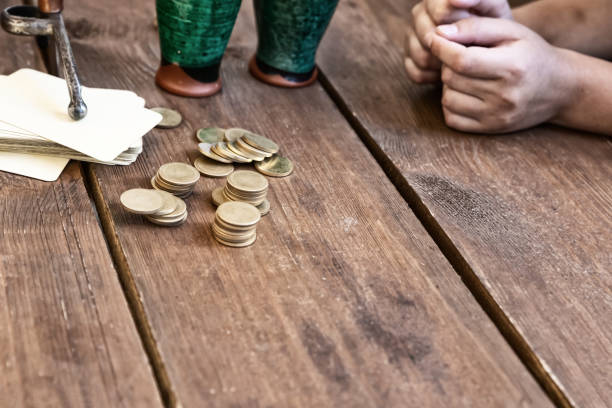 istock card game stack of cards and stack of coins on wooden table 1331352110