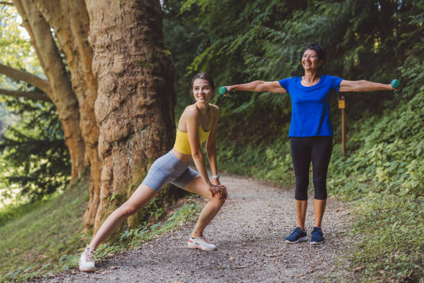istock Young woman and active senior woman stretching before a run 1331354687