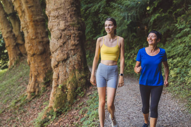 istock Young woman and active senior woman stretching before a run 1331354797