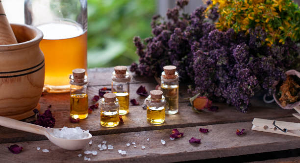 istock Essential oil bottles with dry ingredients 1331355948