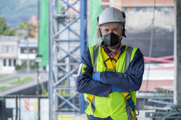 istock Latin man engineer of a construction site looks at the camera that portrays him 1331355960