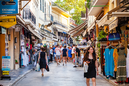 Athens, Greece - People enjoying hot summer day in Plaka district, famous by many shops and restaurants
