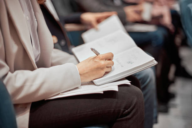 istock business woman taking notes in her notebook 1331356922