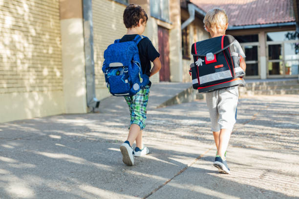 istock Two Happy Boys Going To School. 1331358463
