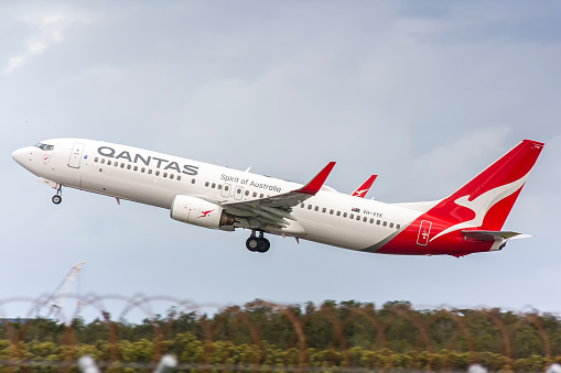 This image is taken of a Boeing 737-800 painted in the Qantas spirit of Australia livery as it departs Brisbane International Airport. This photo was taken during Covid times whilst there was a large reduction in flights in and out of Brisbane airport. Qantas Airways Limited is the flag carrier of Australia and its largest airline by fleet size, international flights and international destinations. It is the world's third-oldest airline still in operation, having been founded in November 1920; it began international passenger flights in May 1935.